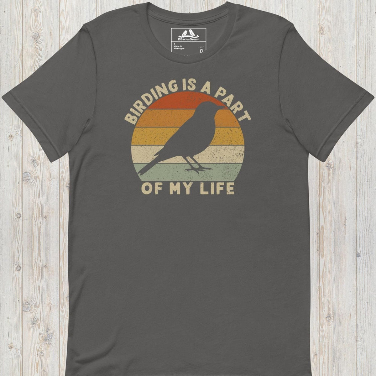 Gray bird lover t-shirt with a vintage sunset graphic, bird silhouette and the quote "Birding Is A Part Of My Life"