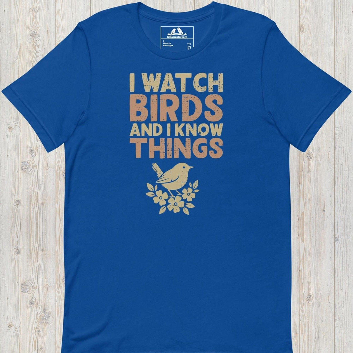 Blue I watch birds and I know things t-shirt with a bird graphic and floral elements