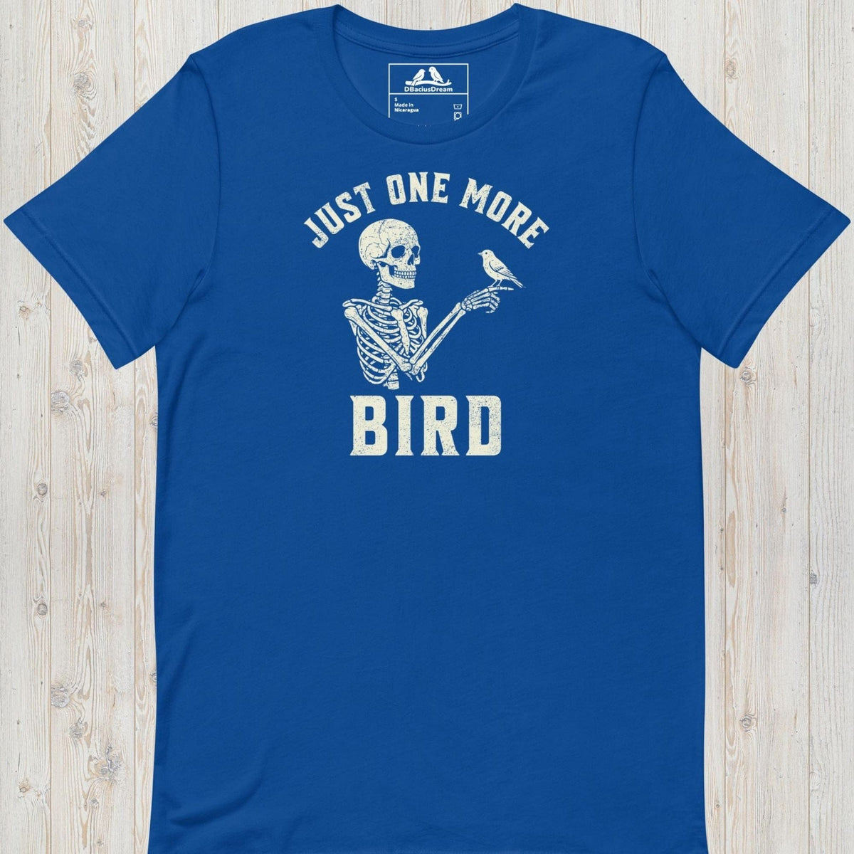 Blue just one more bird t-shirt with a skeleton birder graphic and the quote "Just One More Bird"