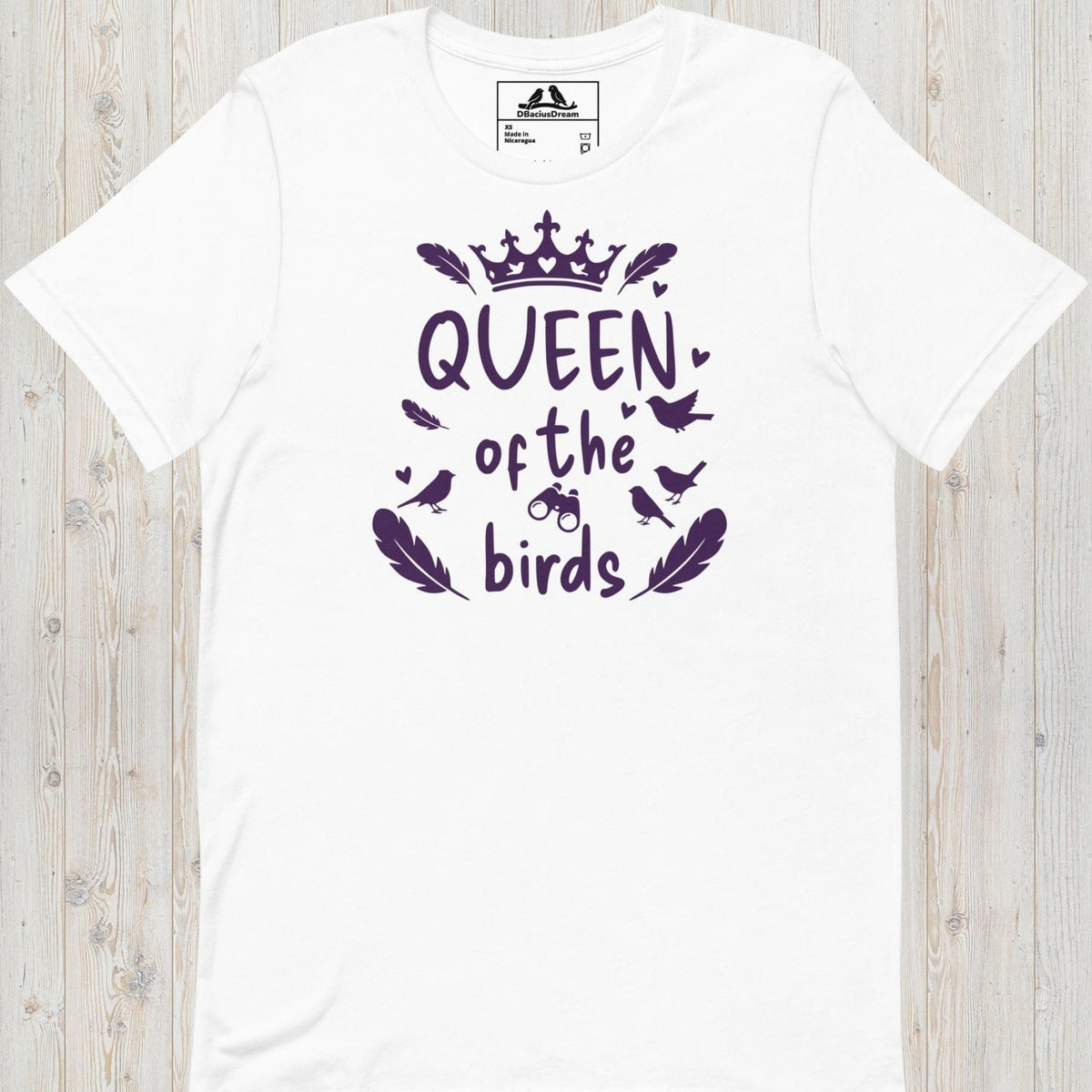 White queen of the birds t-shirt with a purple bird graphic, crown design and decorative bird silhouettes