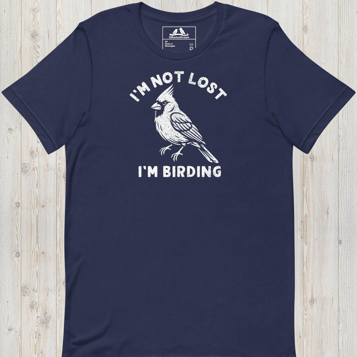 Dark blue funny birding t-shirt featuring a northern cardinal and "I'm Not Lost I'm Birding" text