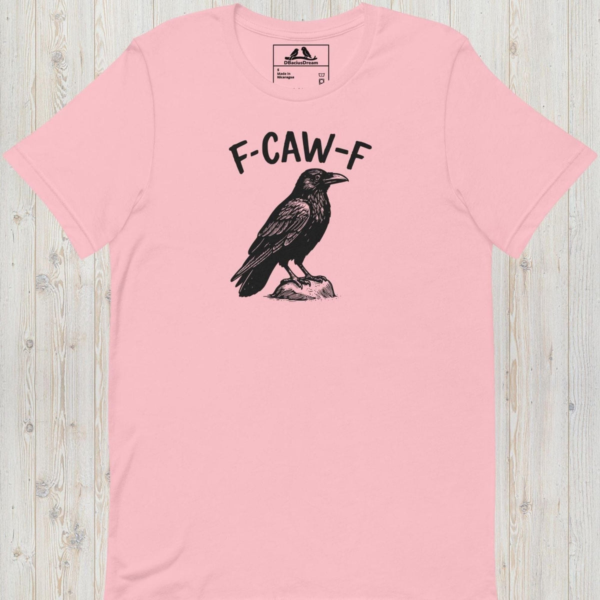 Pink funny crow t-shirt with a crow graphic and the humorous quote "F-Caw-F"