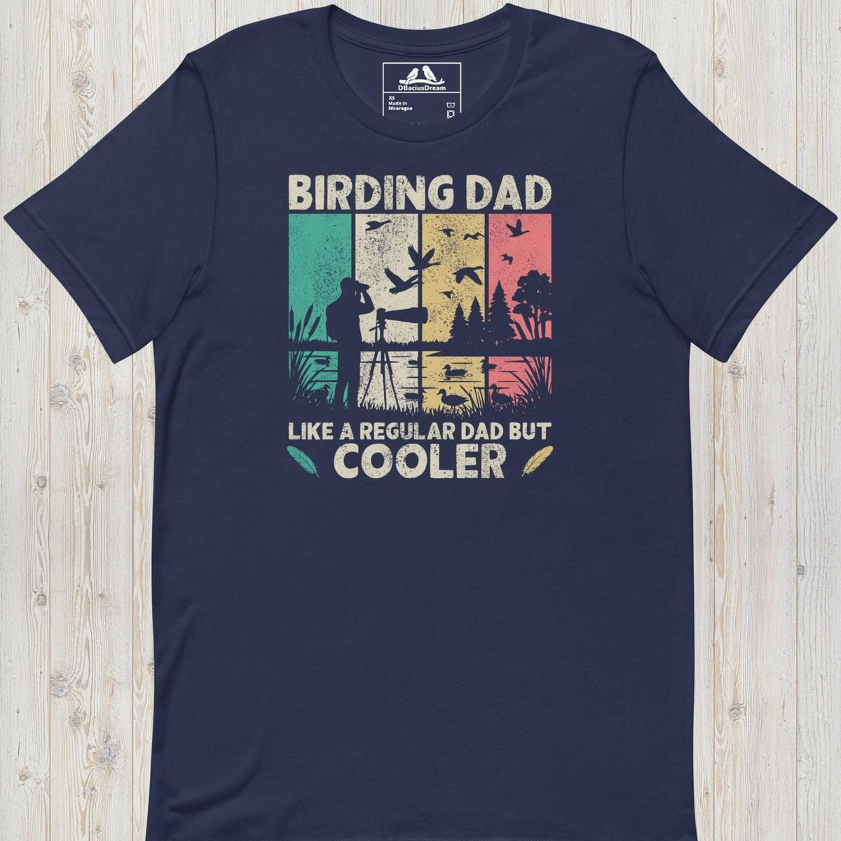 Dark blue birding dad t-shirt featuring a vintage birdwatching graphic and the quote "Birding Dad Like a Regular Dad But Cooler"