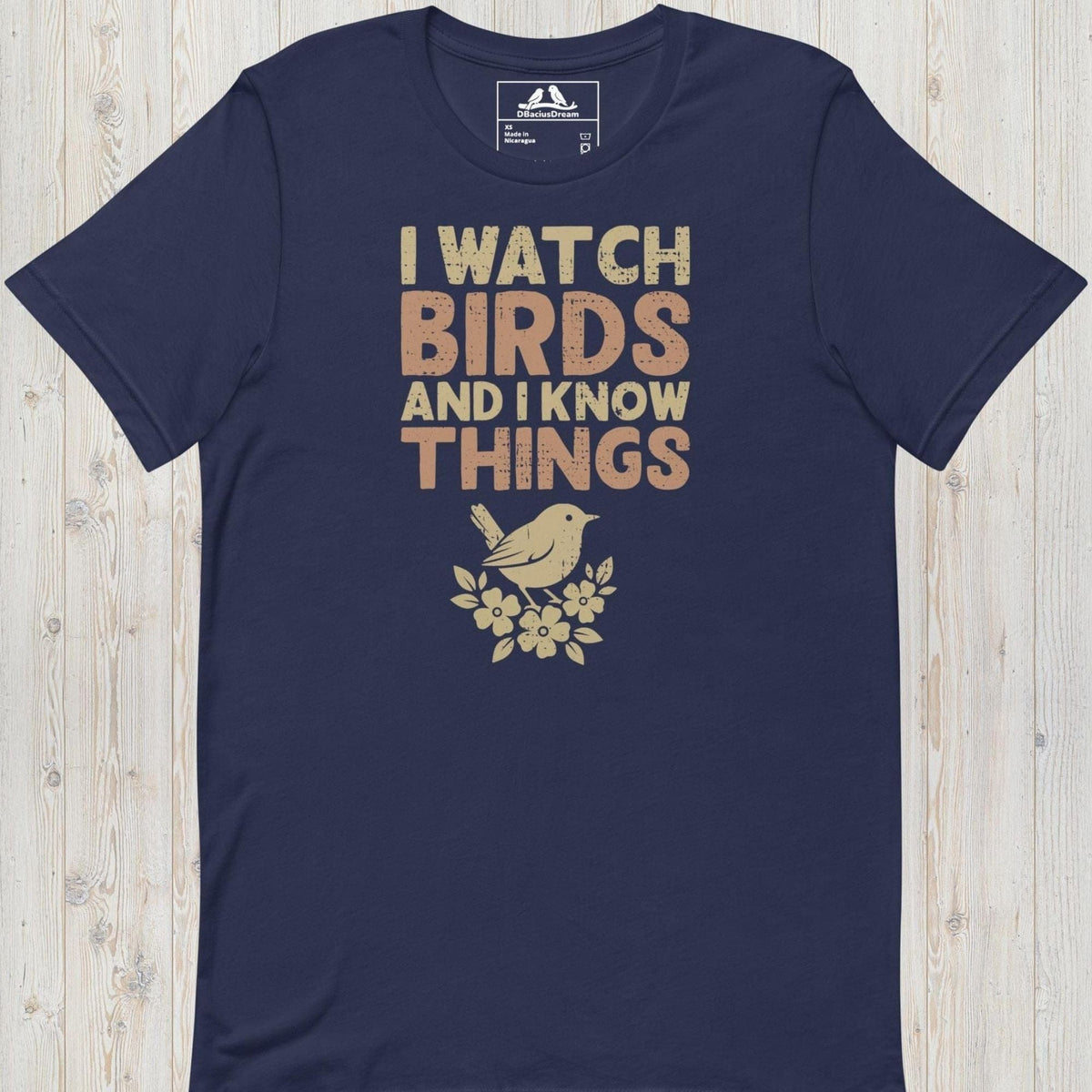 Dark blue I watch birds and I know things t-shirt with a bird graphic and floral elements