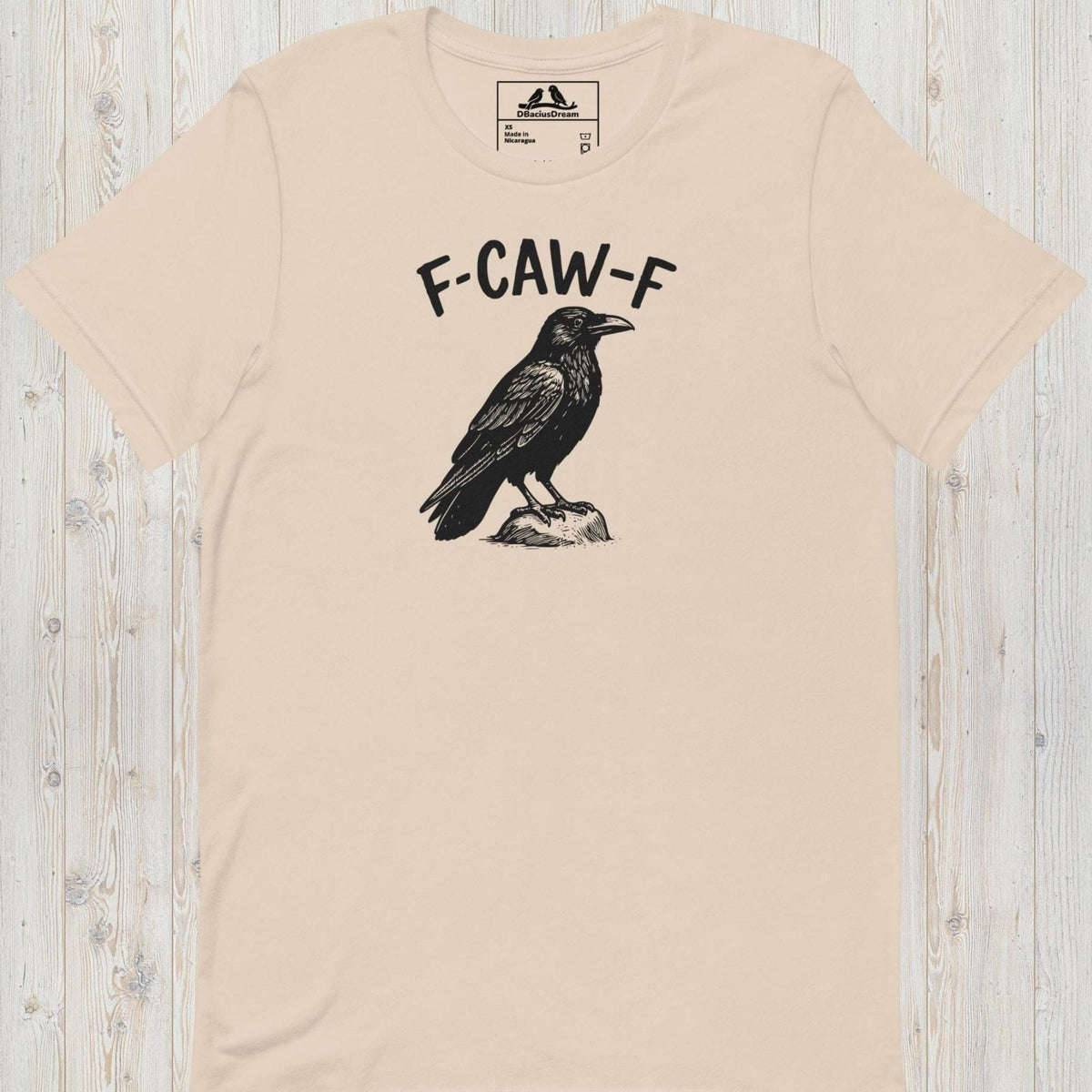 Light beige funny crow t-shirt with a crow graphic and the humorous quote "F-Caw-F"
