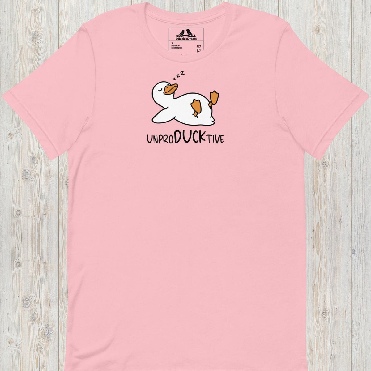 Pink funny duck t-shirt featuring a lazy duck lying on its back and the text "UnproDUCKtive"