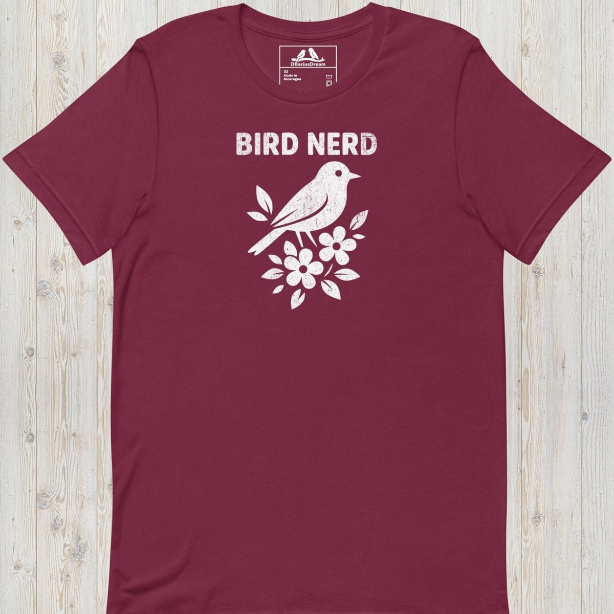 Maroon vintage bird nerd t-shirt featuring a simple white bird graphic and Bird Nerd text