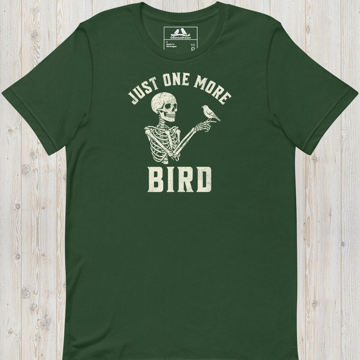 Green just one more bird t-shirt with a skeleton birder graphic and the quote "Just One More Bird"