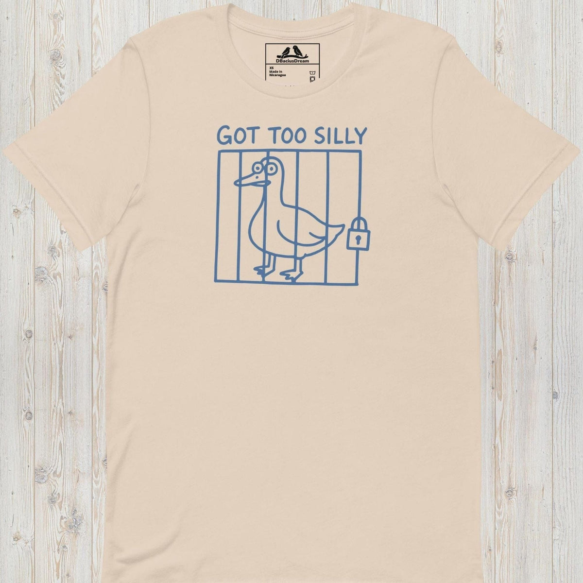 Light beige got too silly funny goose t-shirt with a minimalist goose illustration behind bars and the quote "Got Too Silly"