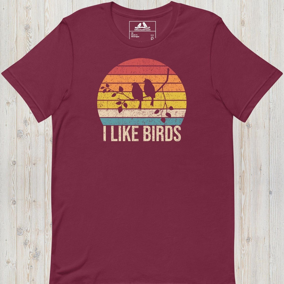 Maroon I Like Birds graphic t-shirt with sunset bird silhouette design