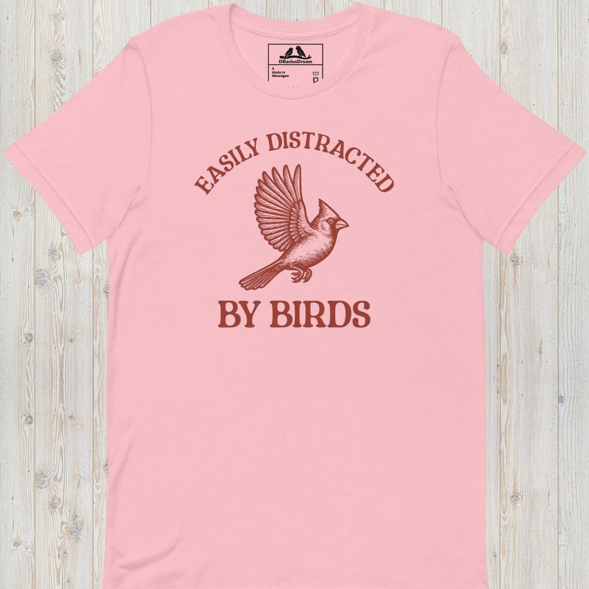 Pink Easily Distracted By Birds T-Shirt with vintage flying bird graphic and text design