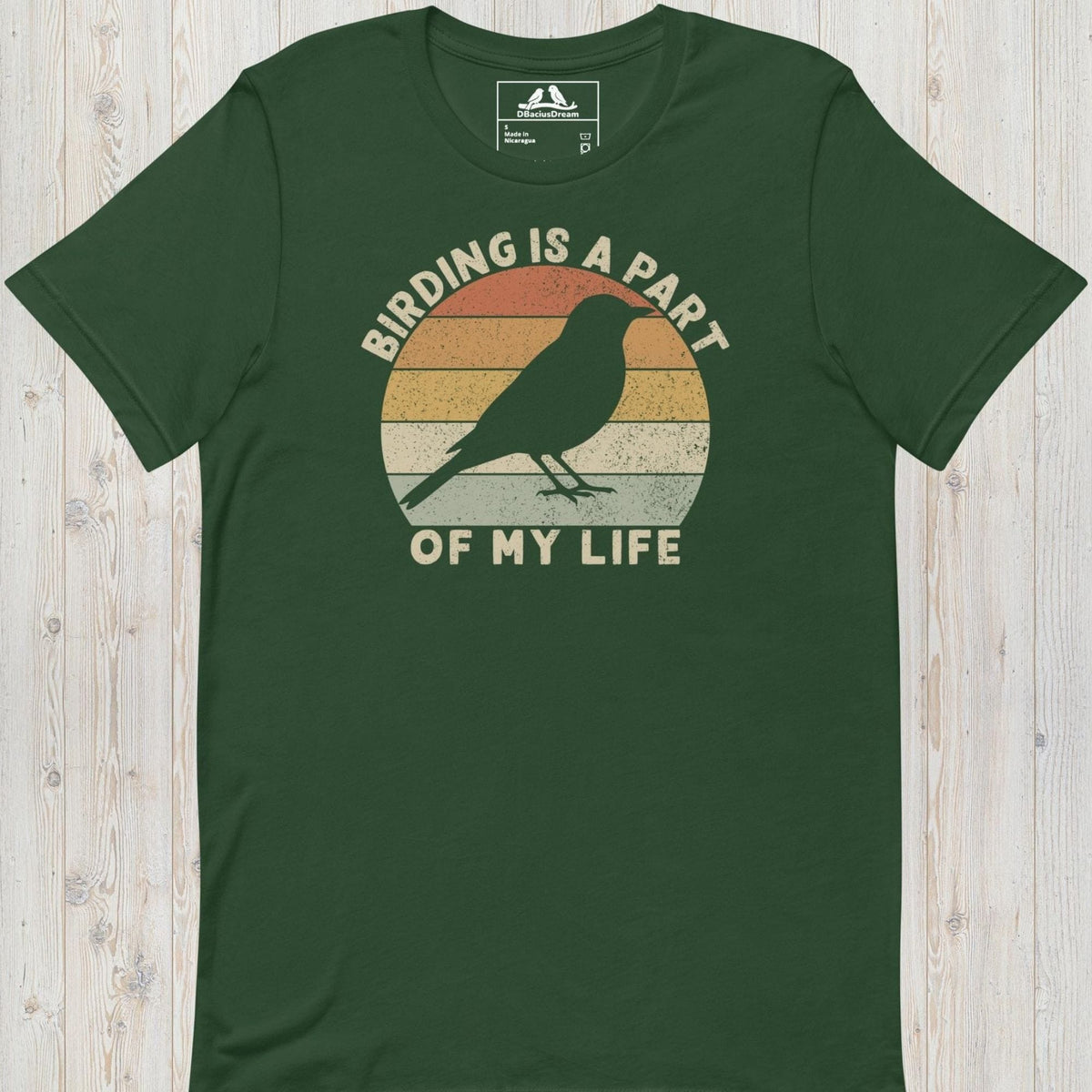 Green bird lover t-shirt with a vintage sunset graphic, bird silhouette and the quote "Birding Is A Part Of My Life"