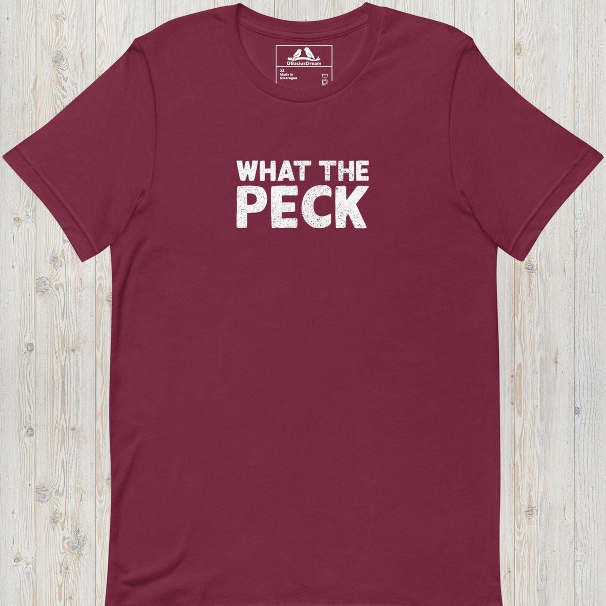 Maroon bird pun t-shirt with "What The Peck" funny quote text design