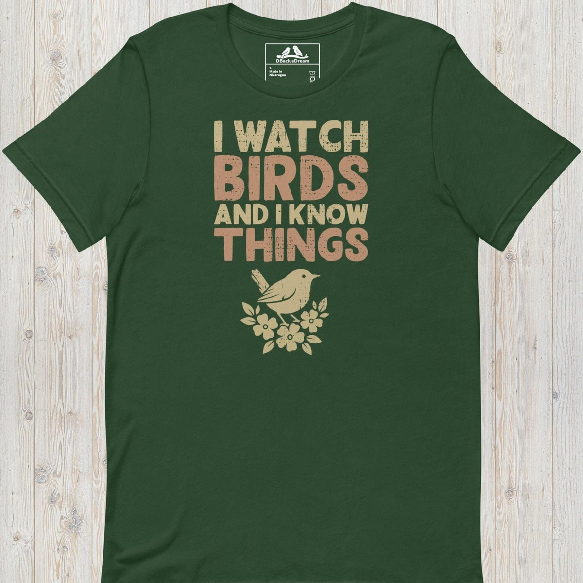 Green I watch birds and I know things t-shirt with a bird graphic and floral elements