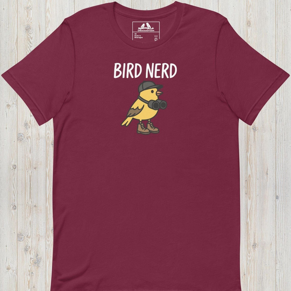 Maroon cute bird nerd t-shirt with a yellow cartoon bird graphic and Bird Nerd text