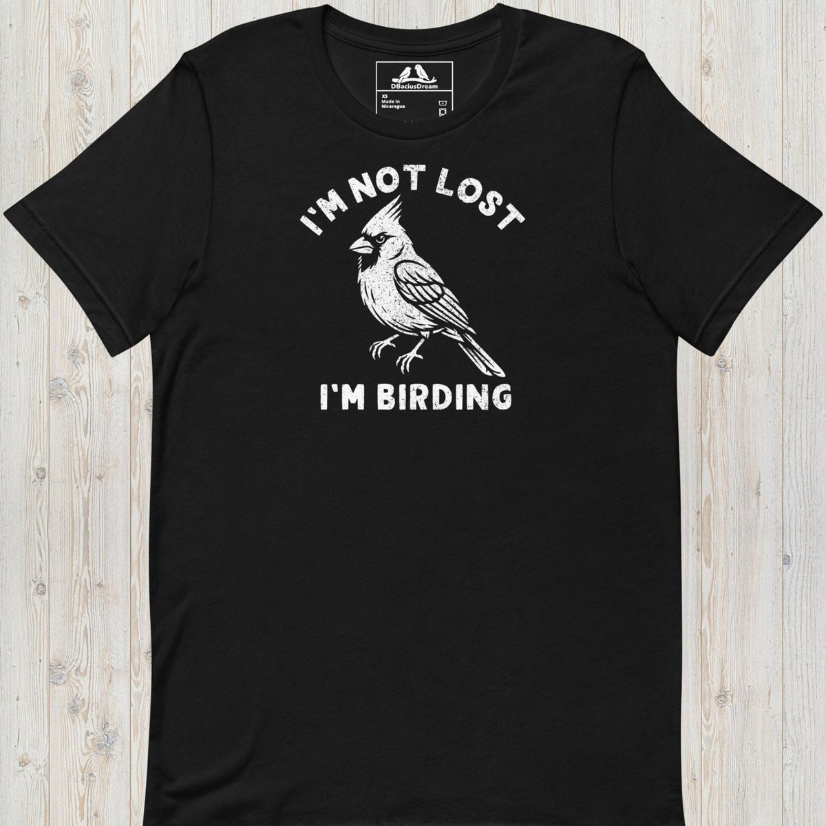 Black funny birding t-shirt featuring a northern cardinal and "I'm Not Lost I'm Birding" text