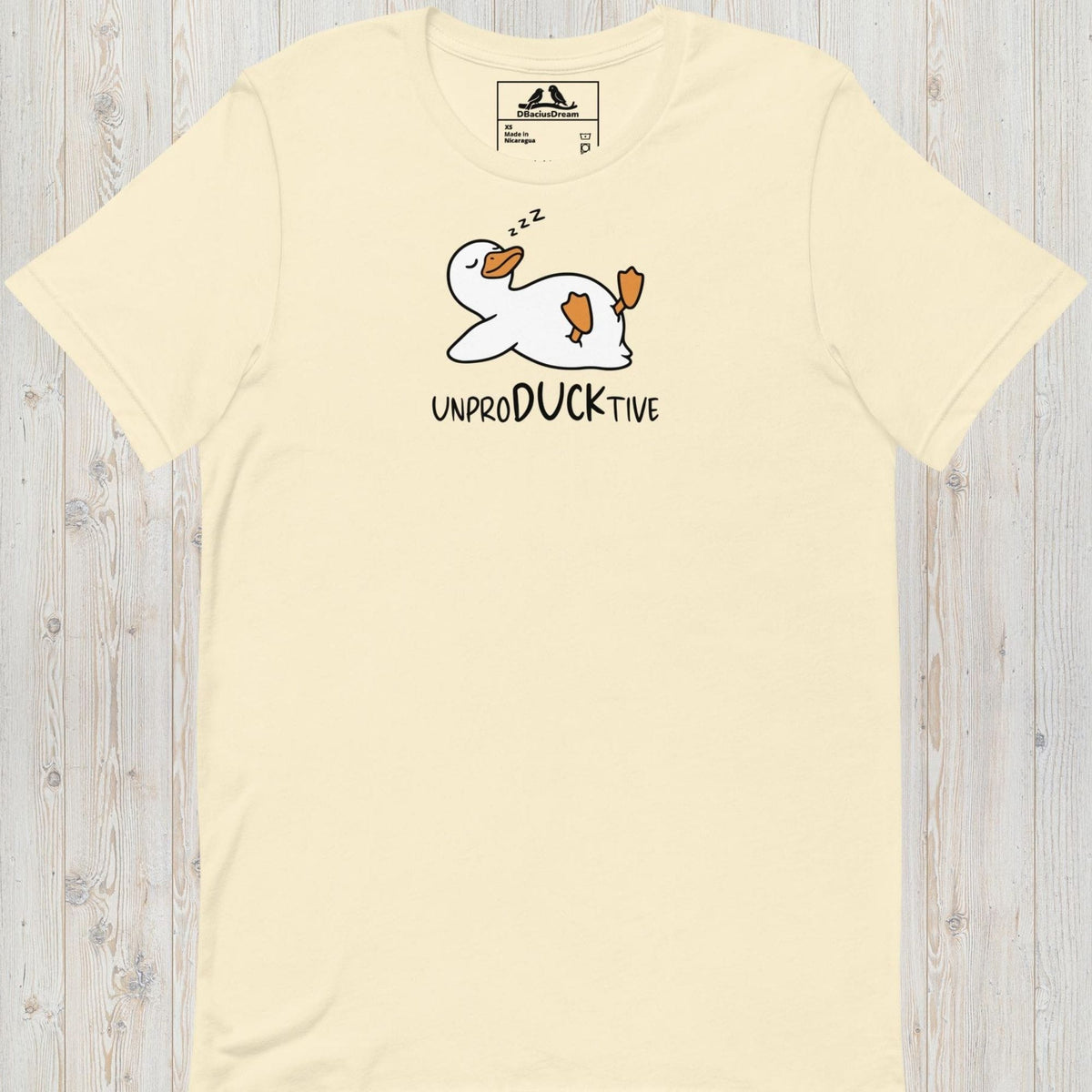 Cream funny duck t-shirt featuring a lazy duck lying on its back and the text "UnproDUCKtive"