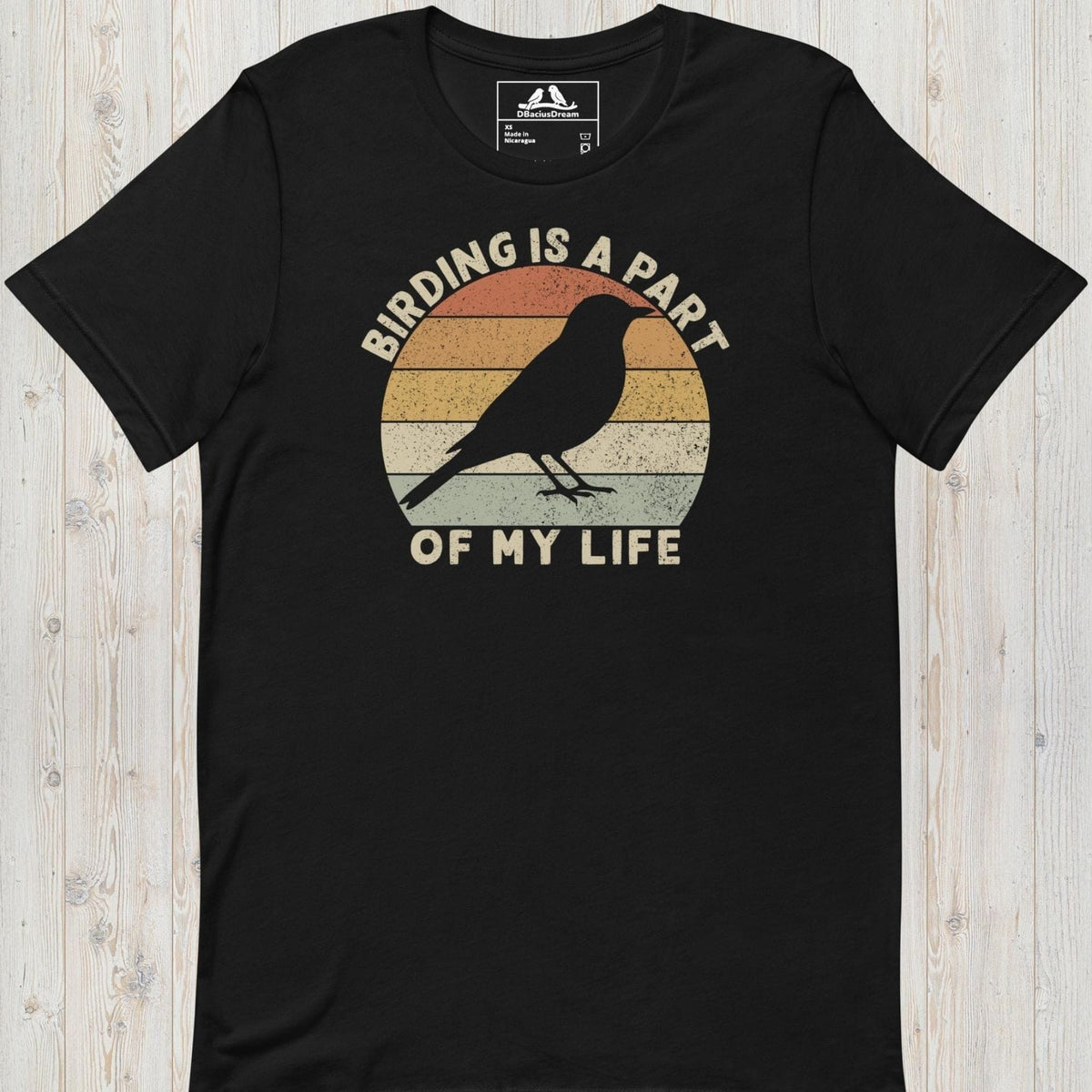 Black bird lover t-shirt with a vintage sunset graphic, bird silhouette and the quote "Birding Is A Part Of My Life"