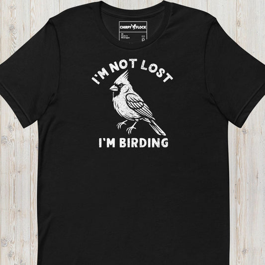 Black funny birding t-shirt featuring a northern cardinal and "I'm Not Lost I'm Birding" text