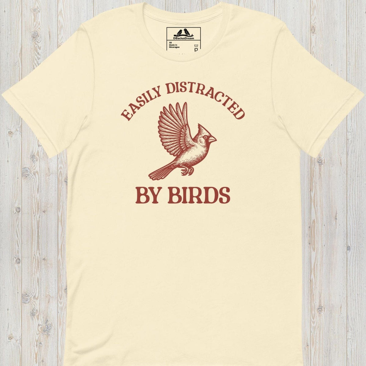 Cream Easily Distracted By Birds T-Shirt with vintage flying bird graphic and text design