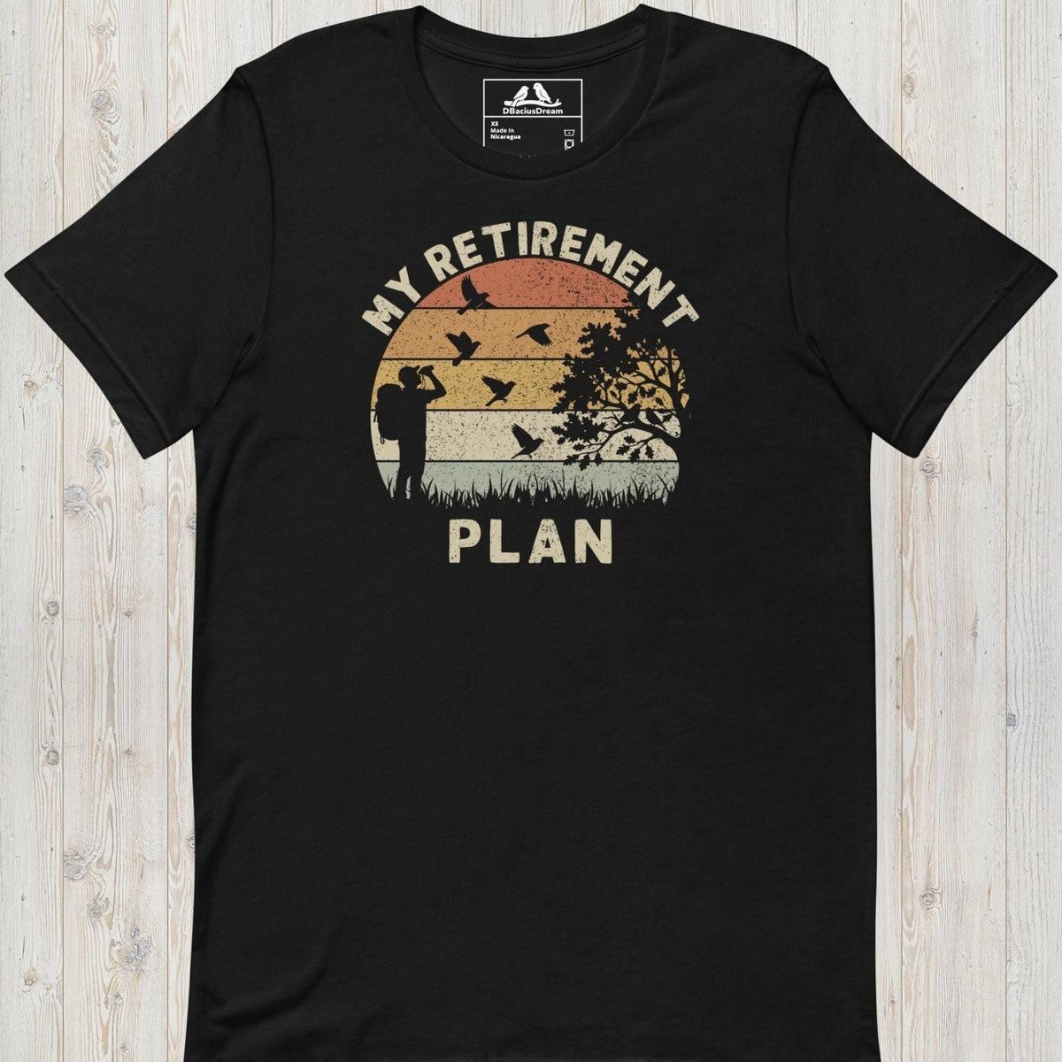 Black birding my retirement plan t-shirt with a vintage sunset graphic, a birder, and flying birds