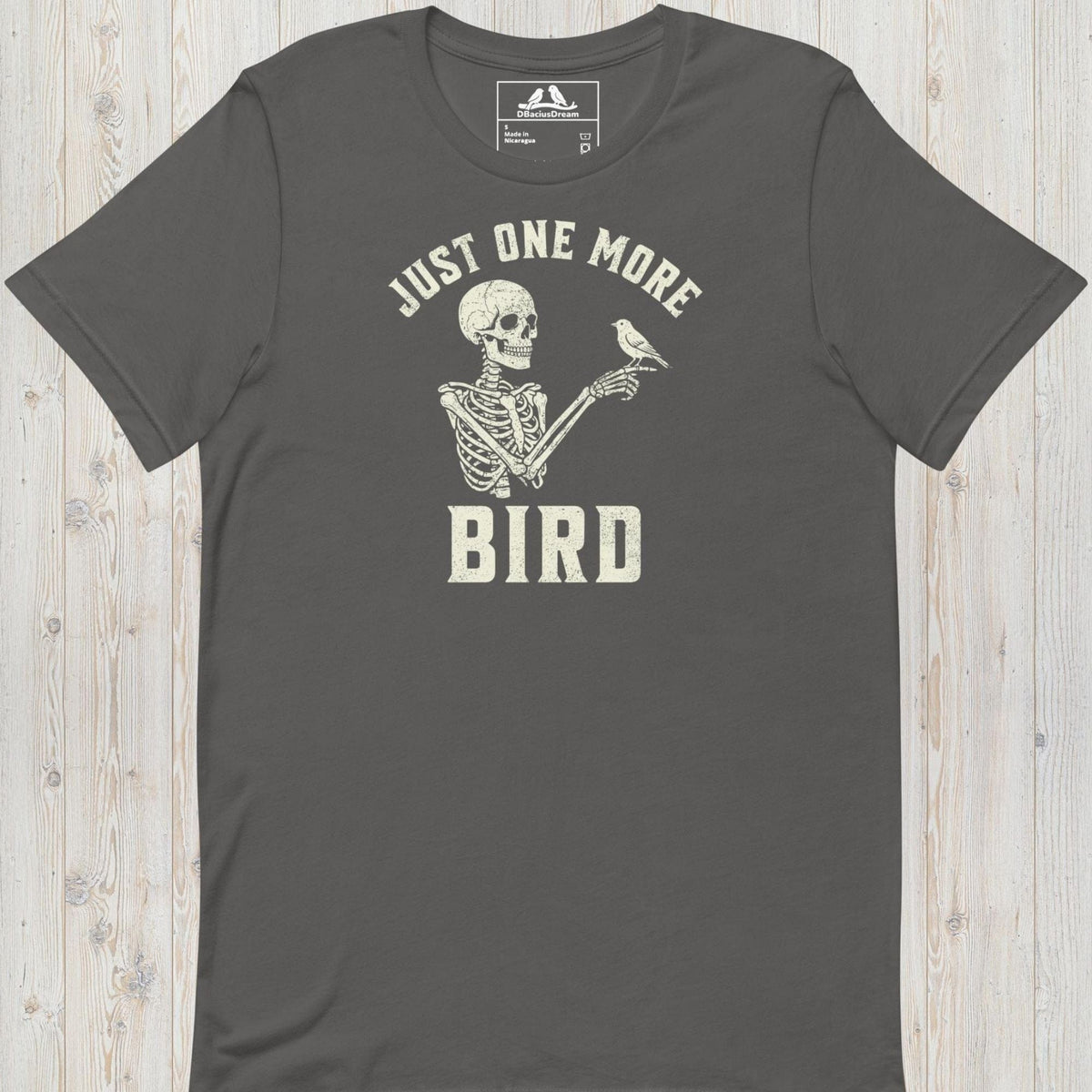 Gray just one more bird t-shirt with a skeleton birder graphic and the quote "Just One More Bird"