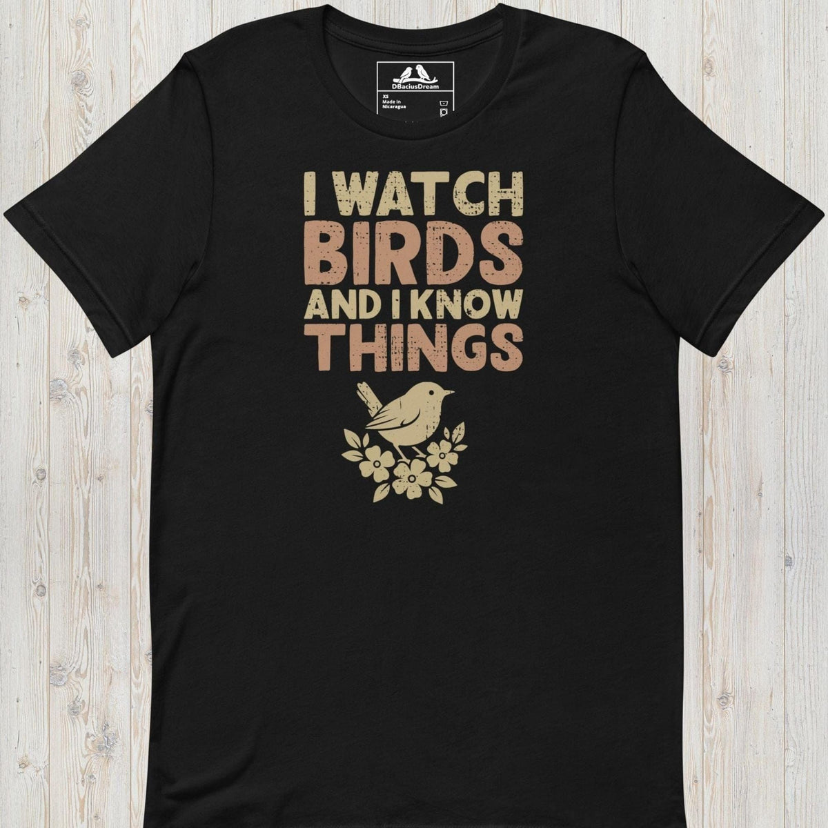 Black I watch birds and I know things t-shirt with a bird graphic and floral elements