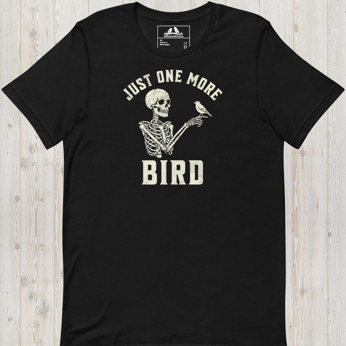 Black just one more bird t-shirt with a skeleton birder graphic and the quote "Just One More Bird"